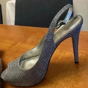 silver glittery open toe heels. Size 8M.